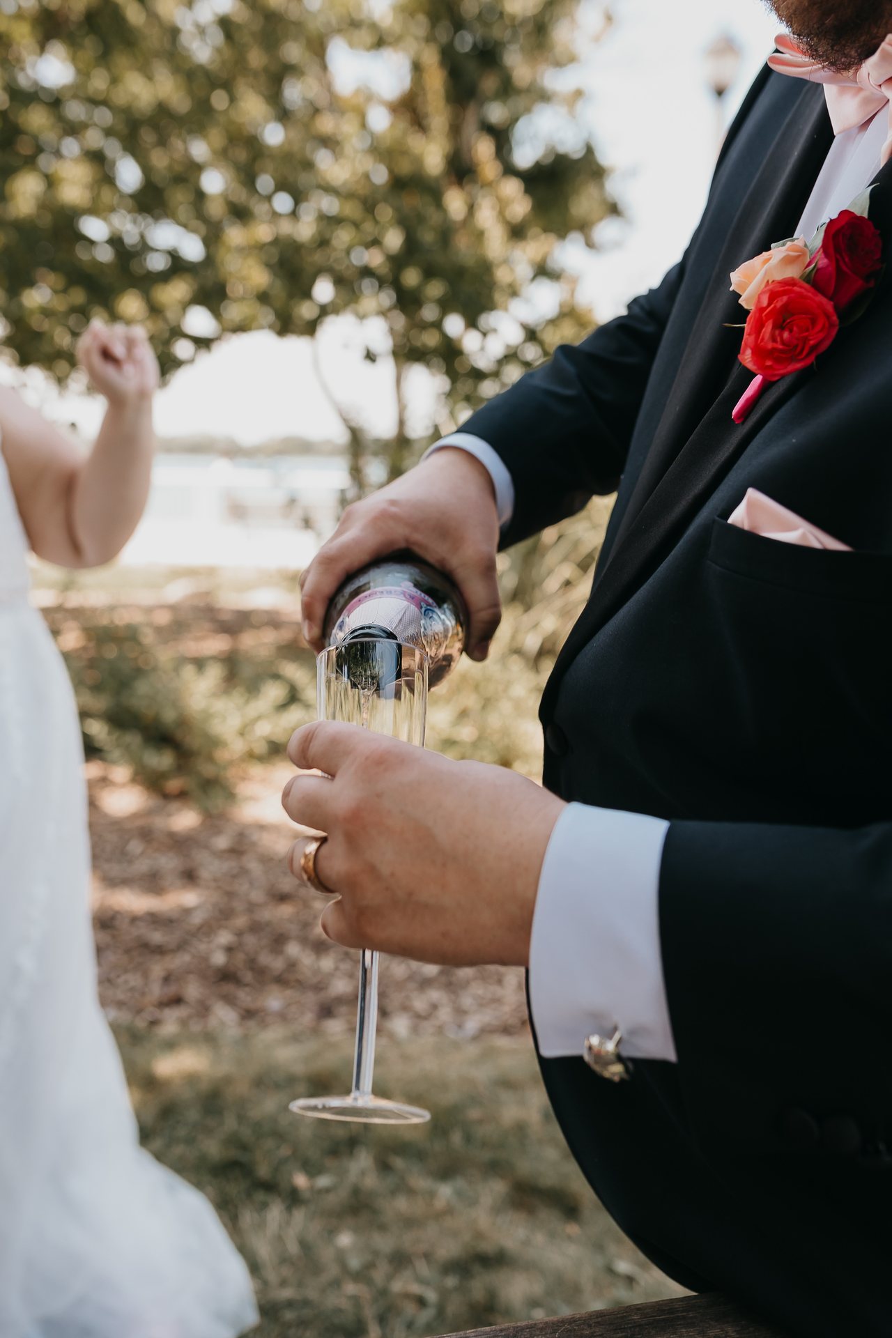 Greg pouring a celebratory drink after the ceremony