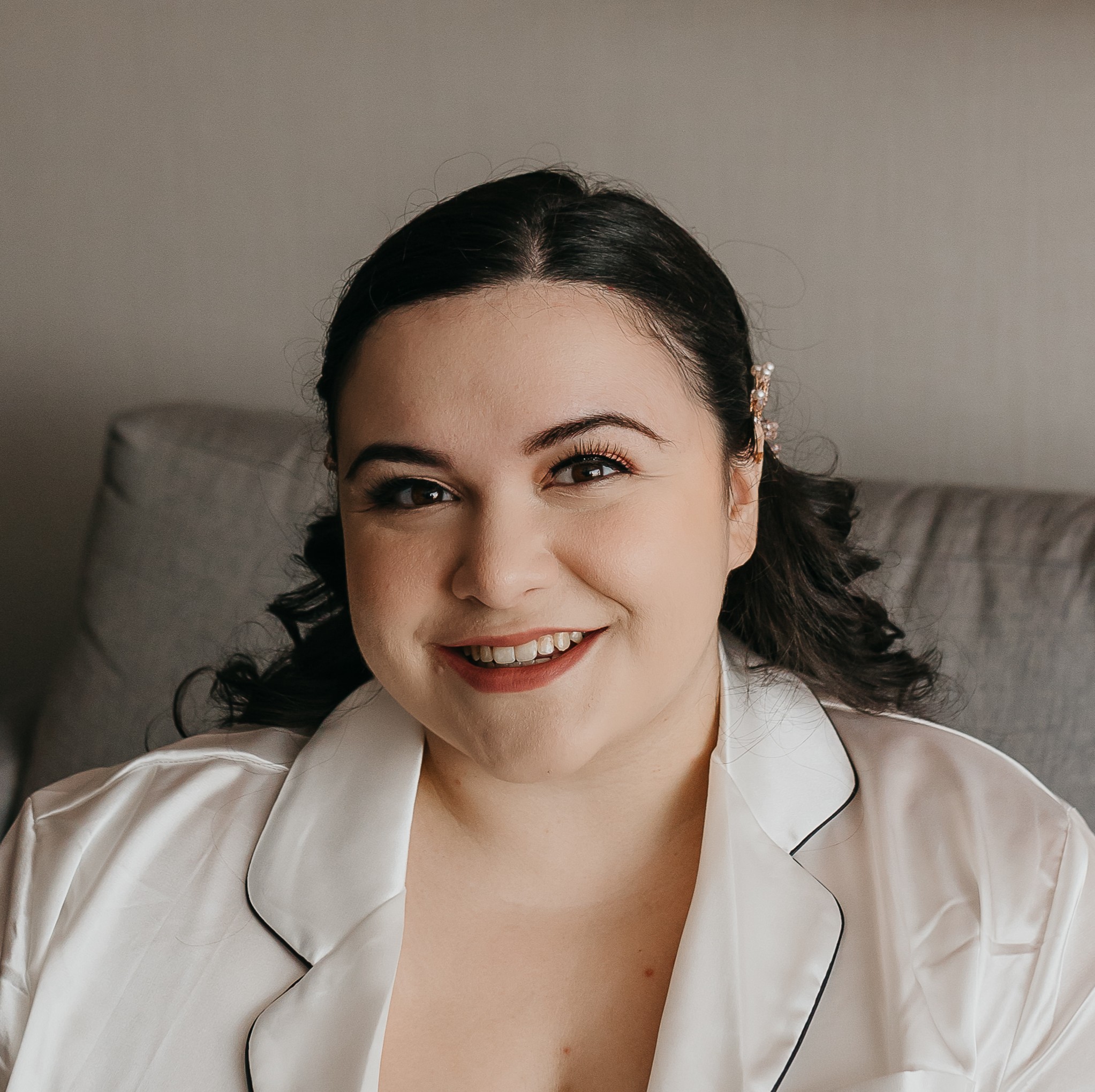 Chelsie smiling in her wedding getting-ready outfit