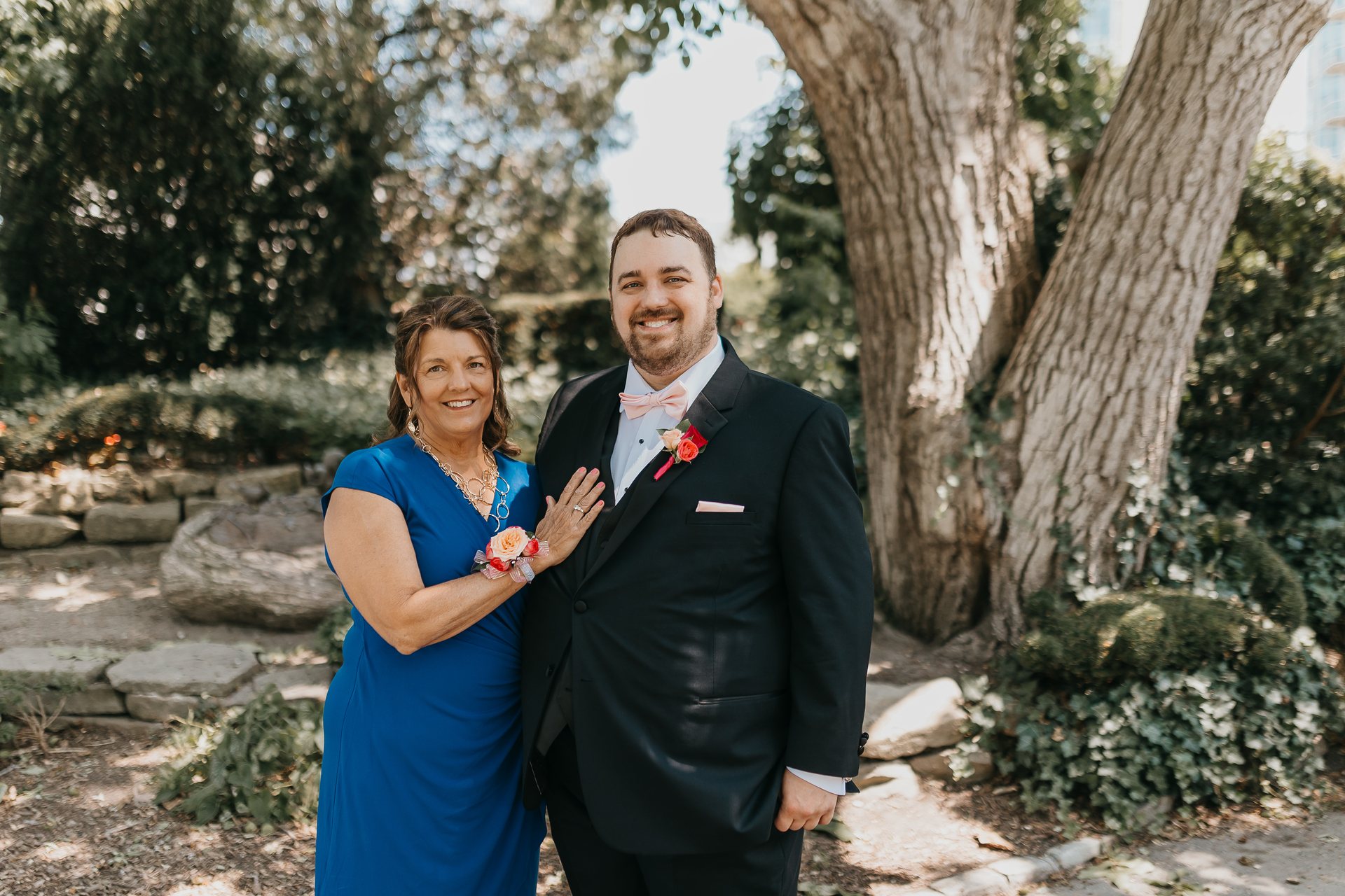 Greg posing with a family member after the wedding