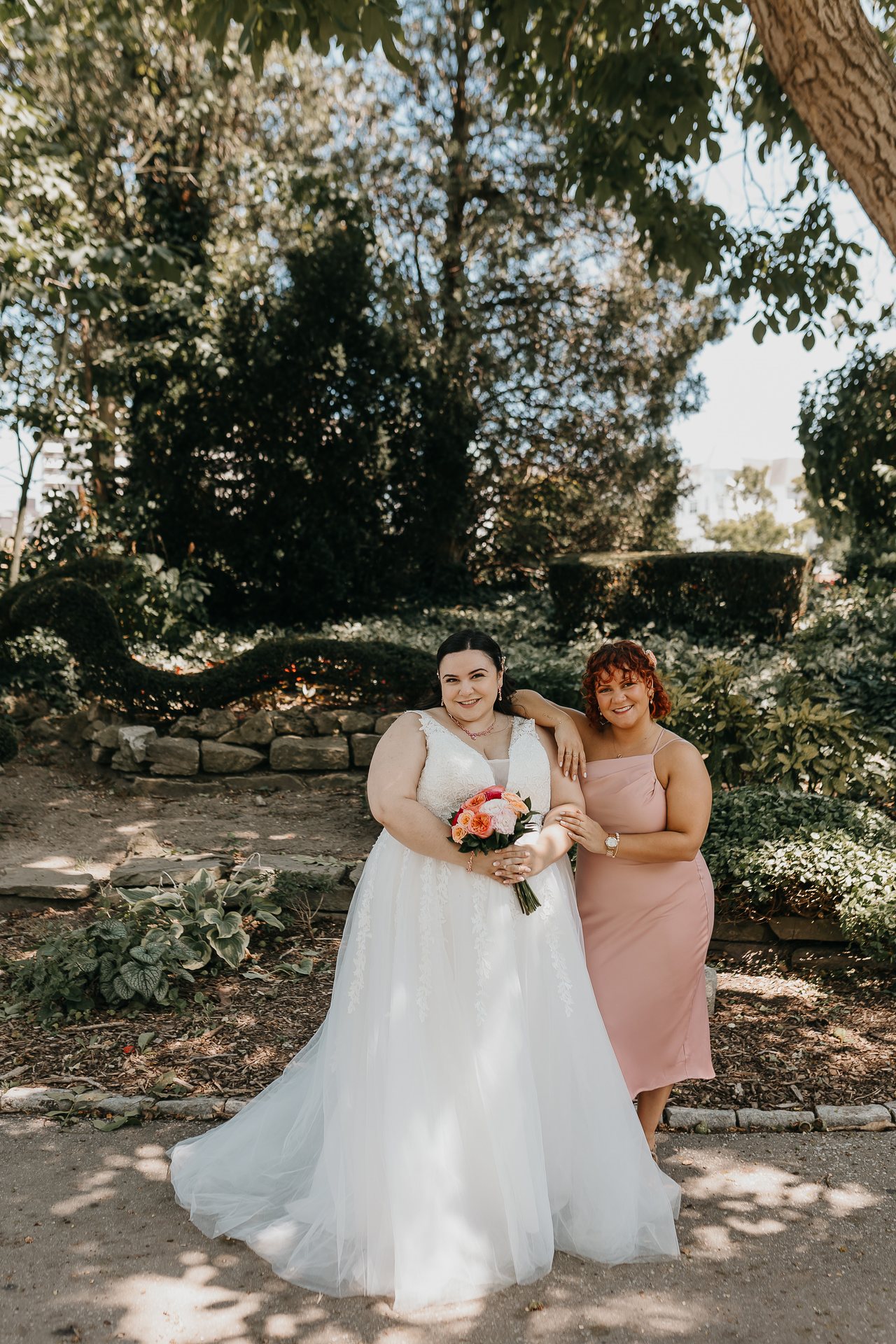 Chelsie posing with a family member in the garden