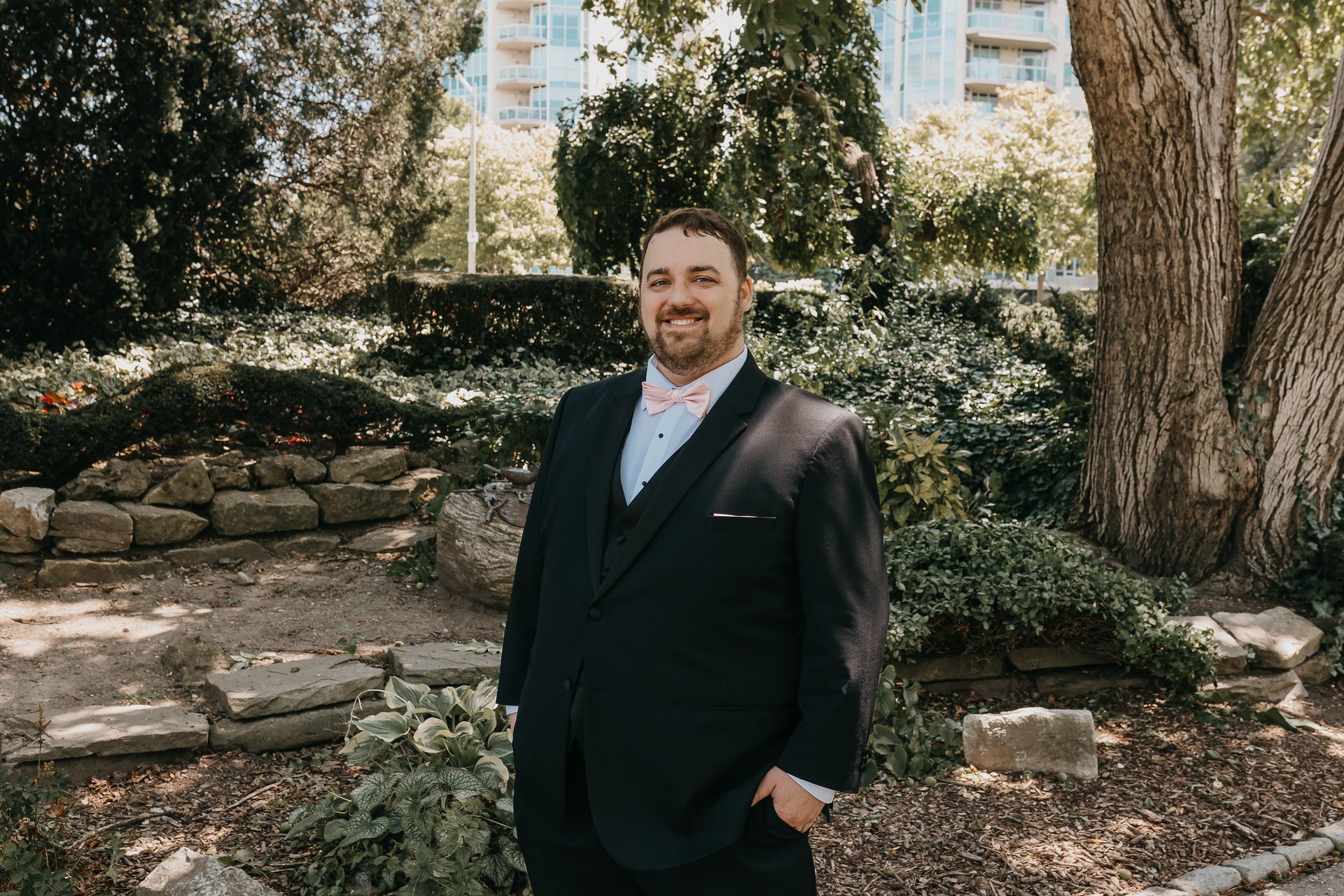 Greg standing outdoors before the first look