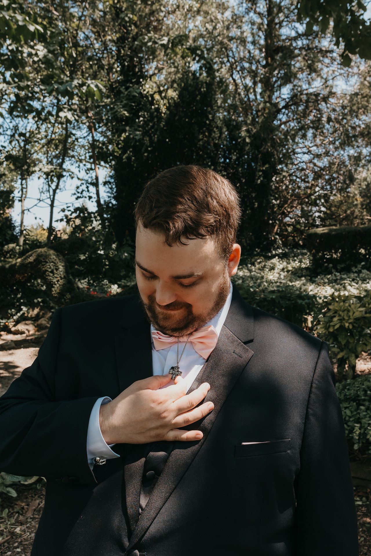 Greg smiling and holding his chest before seeing Chelsie