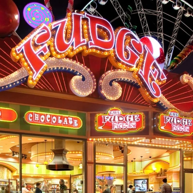 The Fudge Factory storefront at night